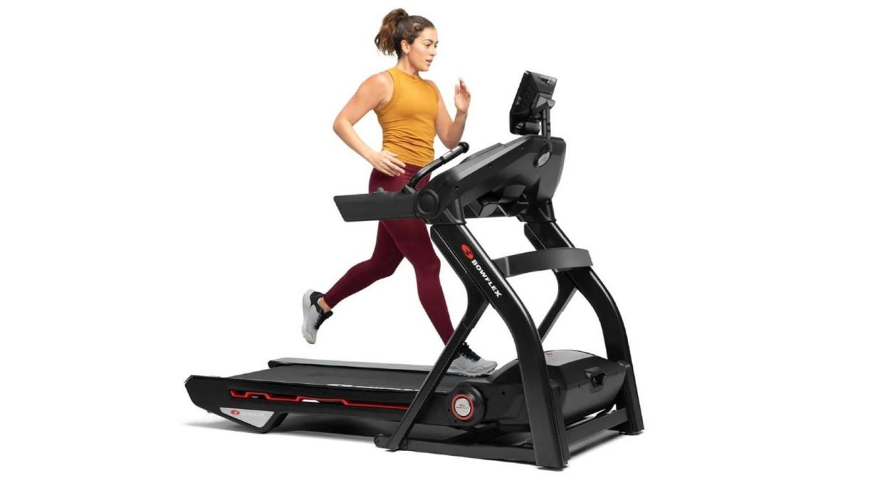  Woman running on Bowflex Treadmill 10 