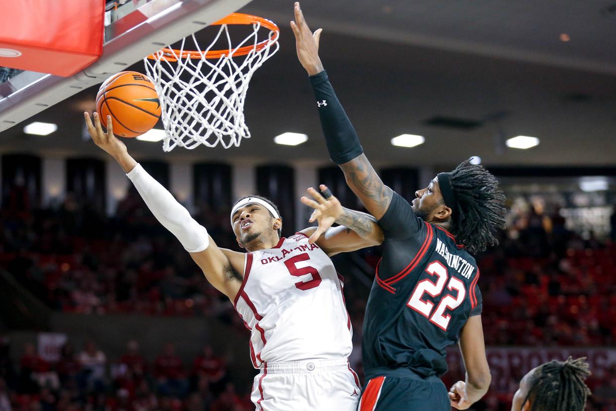 OU guard Rivaldo Soares (5) lays up the ball past Texas Tech forward Warren Washington (22) in the second half on Jan. 27 at Lloyd Noble Center in Norman.