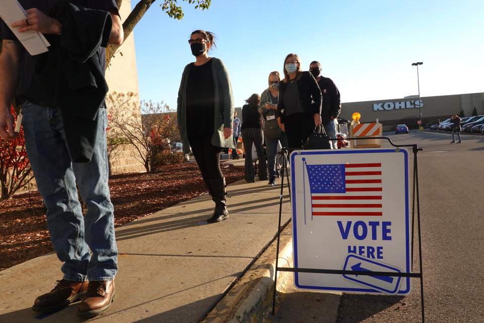 Residents wait in line to vote 