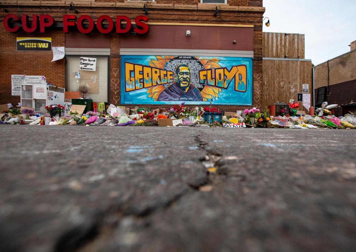 Minneapolis, a city still split along racial lines. <a href="https://www.gettyimages.com/detail/news-photo/the-mural-and-makeshift-memorial-outside-cup-foods-where-news-photo/1216644310?adppopup=true" rel="nofollow noopener" target="_blank" data-ylk="slk:Jason Armond/Los Angeles Times via Getty Images;elm:context_link;itc:0;sec:content-canvas" class="link ">Jason Armond/Los Angeles Times via Getty Images</a>
