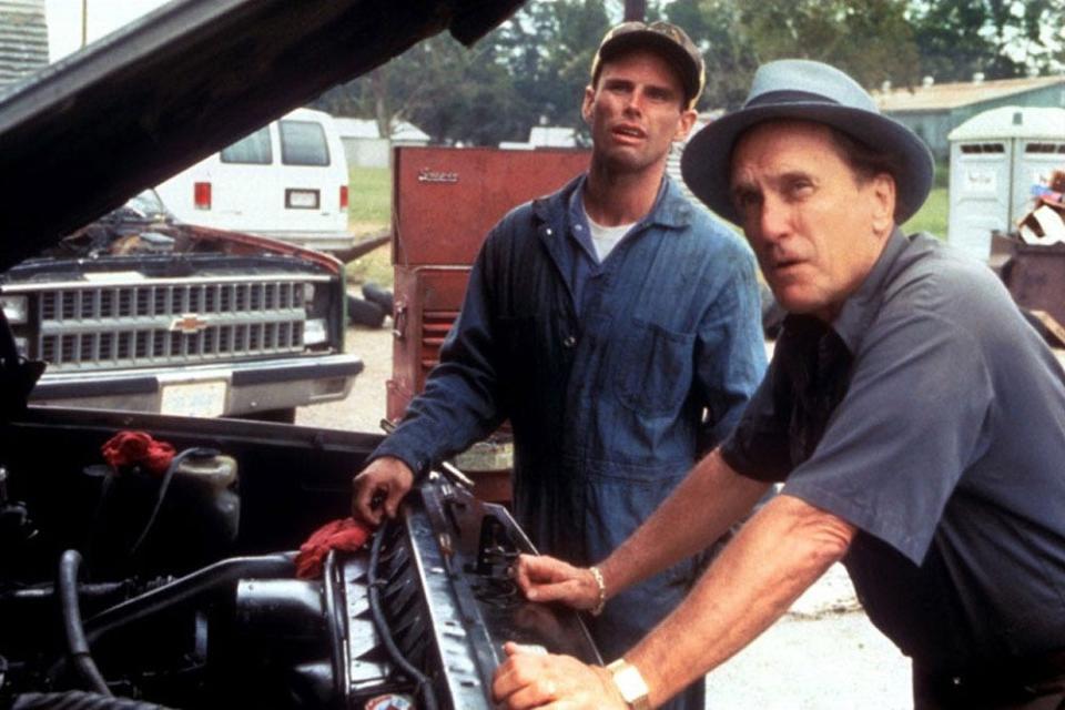 Walton Goggins and Robert Duvall looking at a truck engine