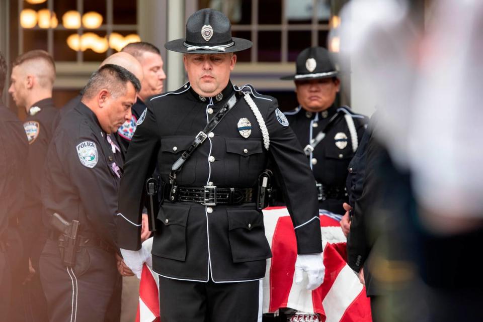 Honor guard officers carry the caskets of Bay St. Louis police officers Sgt. Steven Robin and Branden Estorffe following their funeral at the Bay St. Louis Community Center in Bay St. Louis on Wednesday, Dec. 21, 2022. Robin and Estorffe were killed responding to a call at a Motel 6 on Dec. 14.