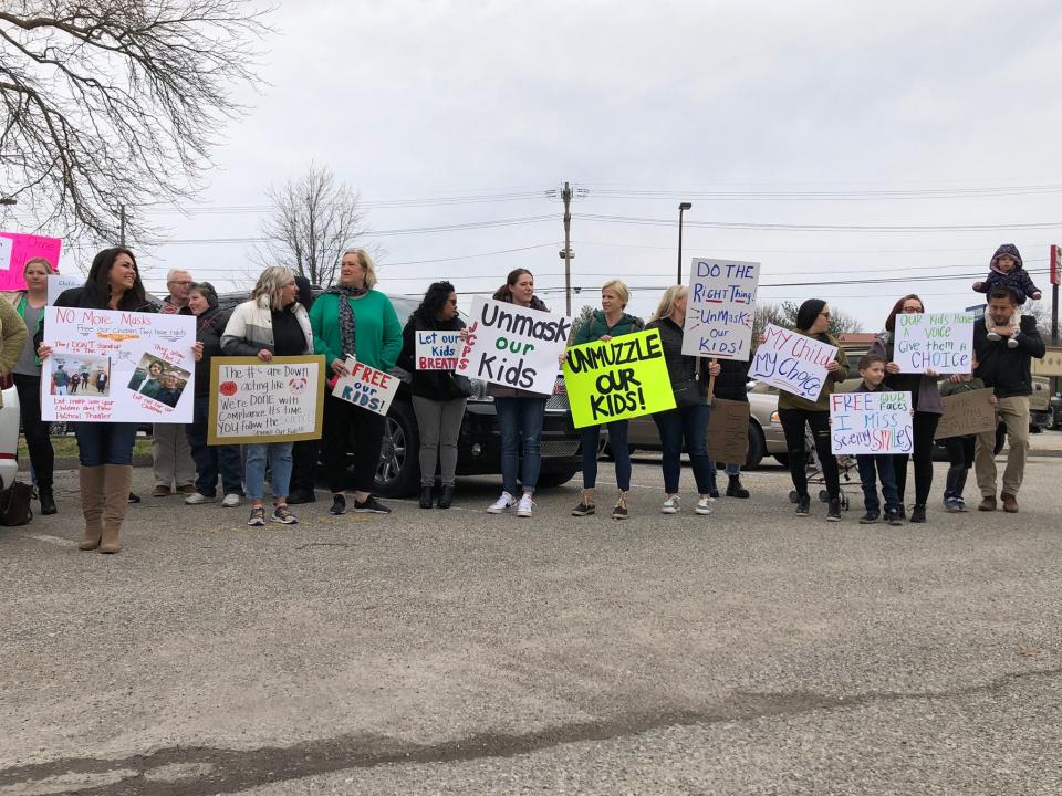 A group of parents and kids gathered outside the VanHoose Education Center for a "No More Masks" rally ahead of the Jefferson County Public Schools board meeting in Louisville Tuesday, March 8, 2022.