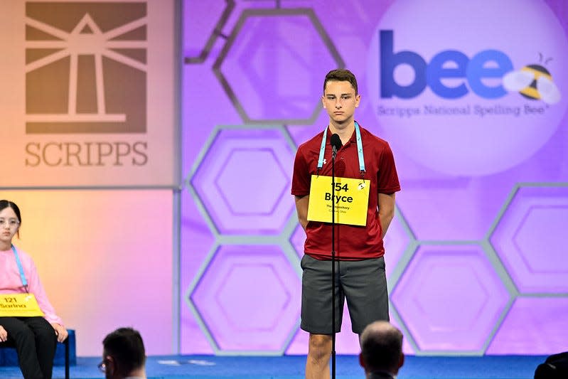 Bryce Beckley listens to Scripps National Spelling Bee Pronouncer Jacques Bailly on Tuesday, May 30, 2023, during the first round of the bee. Beckley, of Dover Middle School, spelled his word wrong, and was eliminated during the round.