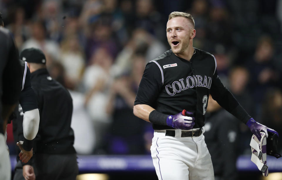 Colorado Rockies' Trevor Story smiles after hitting a game-ending, two-run home run off Baltimore Orioles relief pitcher Mychal Givens during a baseball game Friday, May 24, 2019, in Denver. The Rockies won 8-6. (AP Photo/David Zalubowski)