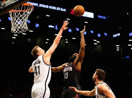 Jan 15, 2017; Brooklyn, NY, USA; Brooklyn Nets center Justin Hamilton (41) defends against a shot by Houston Rockets guard James Harden (13) during the first half at Barclays Center. Mandatory Credit: Andy Marlin-USA TODAY Sports