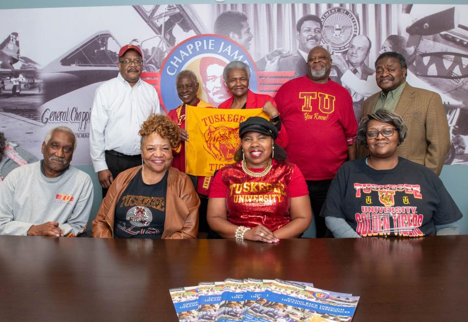 Tuskegee University alumni, back row from left, Myles Sampson (Class of 1984), Shirley Lewis-Brown (Class of 1969), Lusharon Wiley (Class of 1973), Ernest Dawson (Class of 1973), Eddie Todd Jr. (Class of 1975) and, front row from left, Ellis Jones (Class of 1967), Sandra McCreary (Class of 1973), Tondalaio Sears (Class of 1985), and Angela Todd (Class of 1985) pose for a group photo at the Chappie James Museum and Flight Academy in Pensacola on Monday, Jan. 29, 2024.