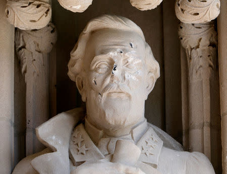 Damage done to the face of a statue of Confederate commander General Robert E. Lee is seen, at Duke University's Duke Chapel in Durham, North Carolina, U.S. August 17, 2017. REUTERS/Jonathan Drake