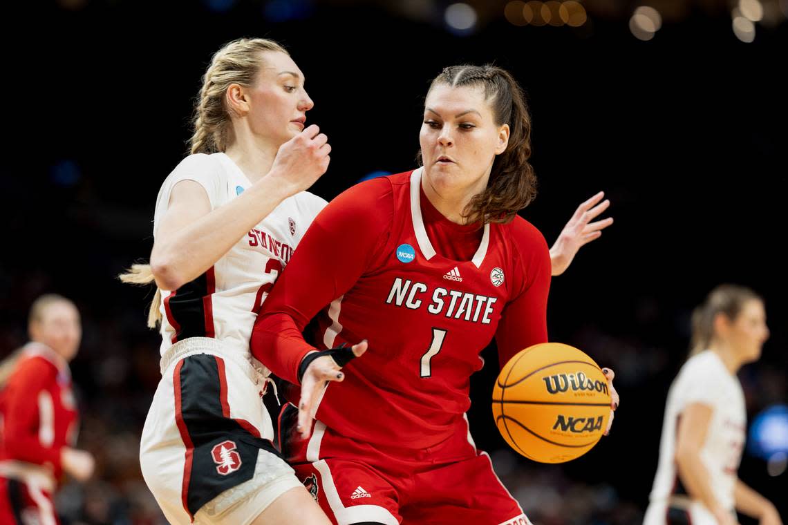 NC State’s River Baldwin drives against Stanford defender Cameron Brink in first half action of their NCAA Sweet 16 game in Portland.