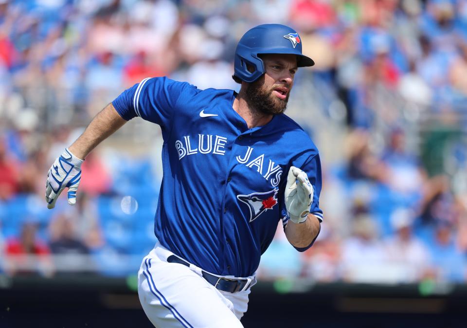 After 12 seasons in San Francisco, Brandon Belt looks strange in a Blue Jays uniform. But he has a .500 OBP this spring as Toronto's designated hitter.