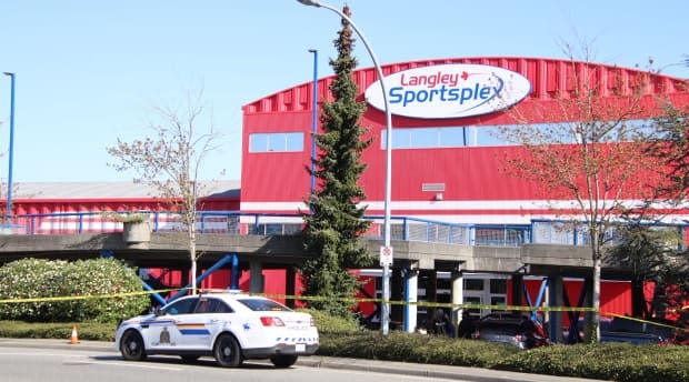 Yellow police tape surrounds the front entrance of the Langley Sportsplex, where a man was fatally shot Wednesday morning.