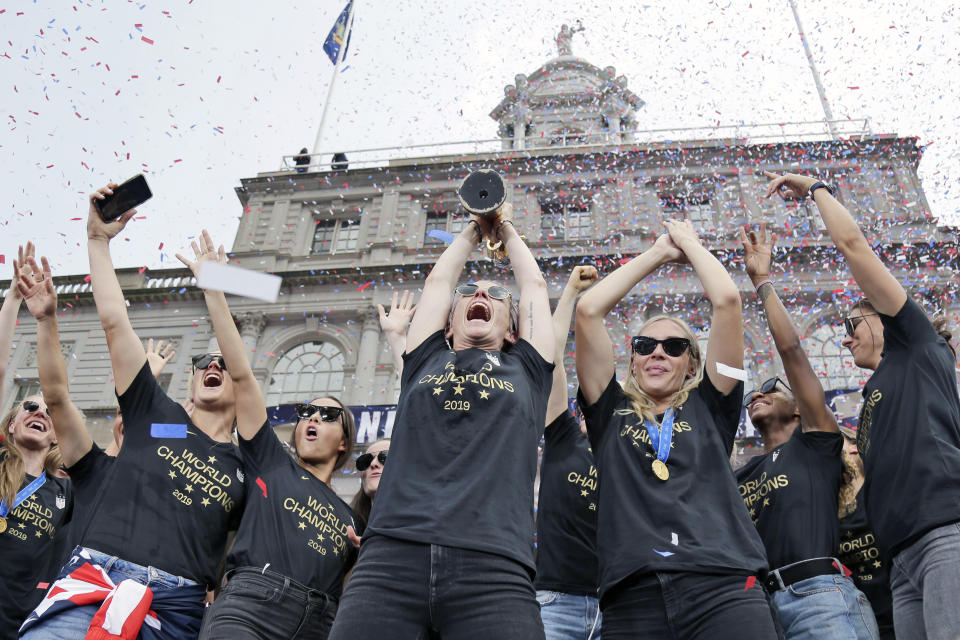 The U.S. women's soccer team celebrates at City Hall.