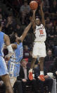 Virginia Tech guard Jalen Cone (15) shoots over North Carolina defender Jeremiah Francis (13) during the second half of an NCAA college basketball game in Blacksburg, Va., Wednesday, Jan. 22, 2020.(AP Photo/Lee Luther Jr.)