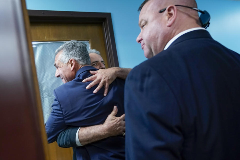 Republican gubernatorial candidate Jack Ciattarelli hugs a supporter after a news conference, Friday, Nov. 12, 2021, in Raritan, N.J. Ciattarelli conceded the race to Democratic Gov. Phil Murphy. (AP Photo/Mary Altaffer)