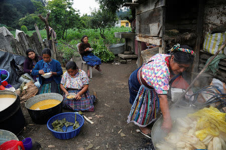 Women prepare tamales for the invitees to the house of the family of Claudia Gomez, a 19-year old Guatemalan immigrant who was shot by an U.S. Border Patrol officer, in San Juan Ostuncalco, Guatemala May 27, 2018. REUTERS/Luis Echeverria