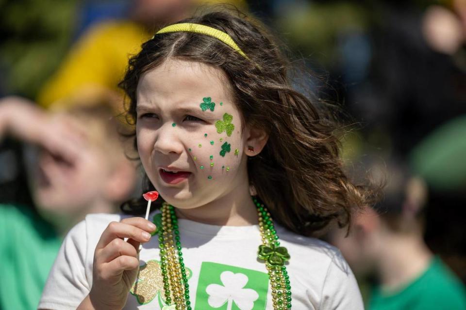 Brynn Stephenson, 8, of North Kansas City, watched the 38th annual Shawnee St. Patrick’s Day Parade on Sunday, March 10, 2024, as it headed east along Johnson Drive.