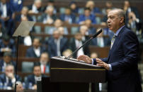 Turkey's President Recep Tayyip Erdogan addresses the members of his ruling Justice and Development Party at the parliament, in Ankara, Turkey, Tuesday, Oct. 16, 2018. Erdogan told journalists on Tuesday that police sought traces of “toxic” materials after a Turkish investigation team inspected areas of the Saudi Arabian consulate in Istanbul where Saudi journalist Jamal Khashoggi disappeared two weeks ago. (Presidential Press Service via AP, Pool)