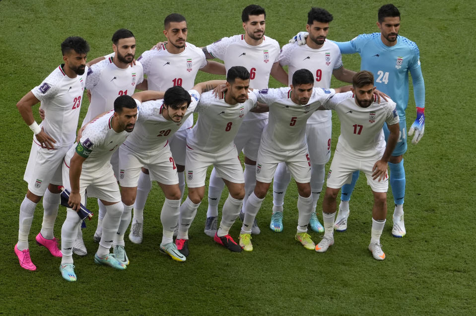 Iran players pose ahead of the World Cup group B soccer match between Wales and Iran, at the Ahmad Bin Ali Stadium in Al Rayyan , Qatar, Friday, Nov. 25, 2022. (AP Photo/Manu Fernandez)