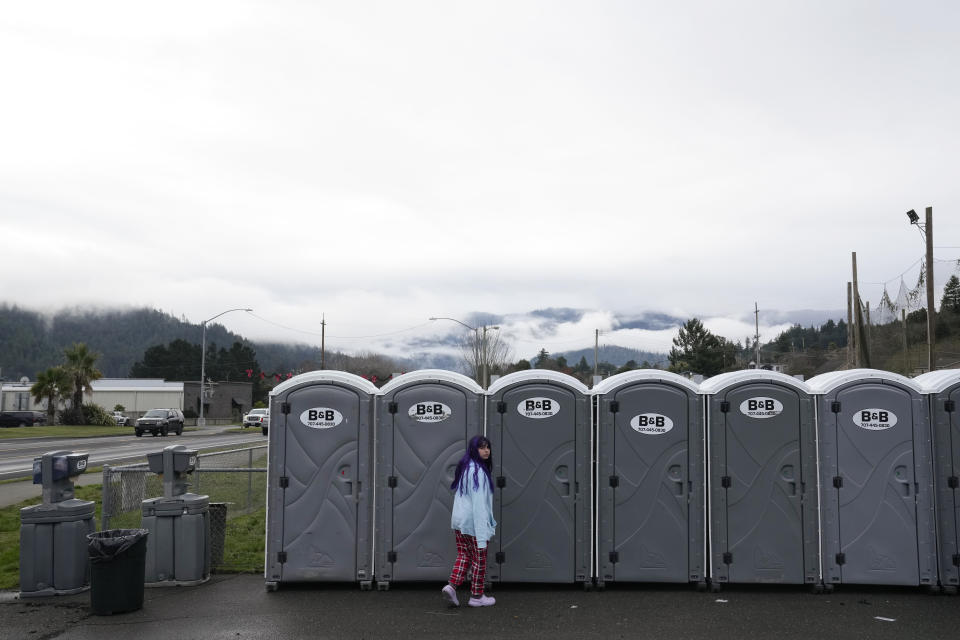 Port-a-potties have been placed outside the fire department after an earthquake in Rio Dell, Calif., Wednesday, Dec. 21, 2022. (AP Photo/Godofredo A. Vásquez)