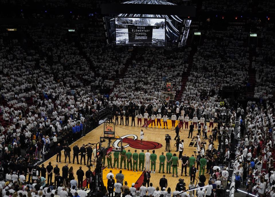 Players from the Miami Heat, Boston Celtics and fans pause for a moment of silence for those killed in Uvalde, Texas before Game 5 of the NBA Playoffs on Wednesday night in Miami.