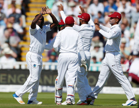 Cricket - England vs West Indies - First Test - Birmingham, Britain - August 17, 2017 West Indies' Kemar Roach (L) celebrates taking the wicket of England's Mark Stoneman Action Images via Reuters/Paul Childs