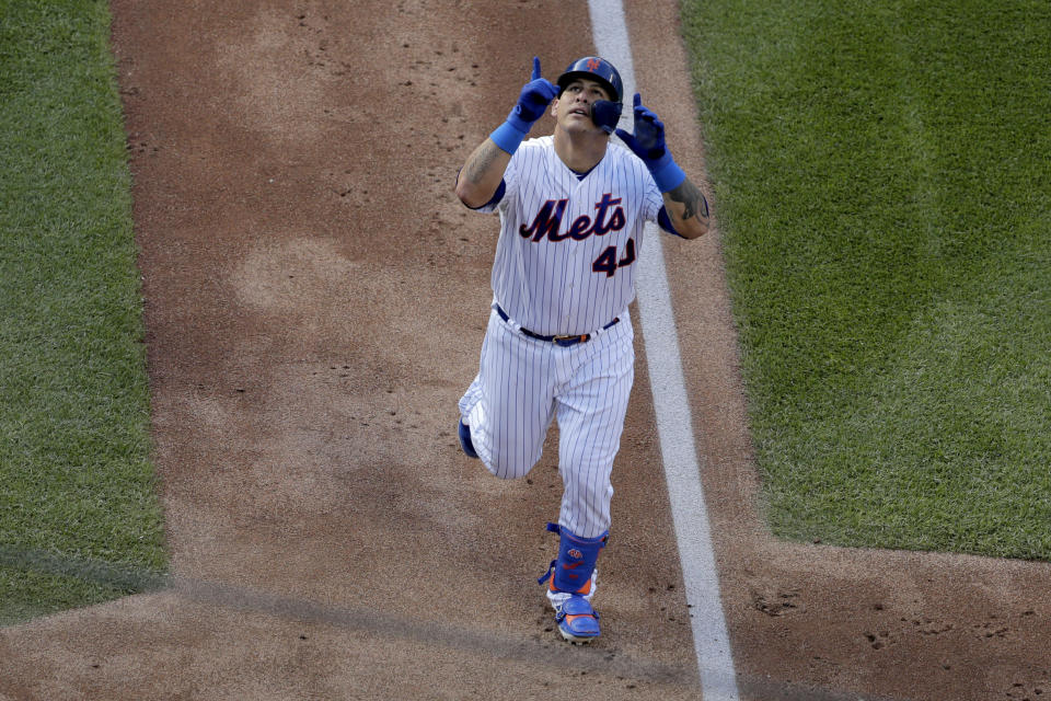 New York Mets' Wilson Ramos gestures before touching home plate after hitting a two-run home run off Detroit Tigers relief pitcher Nick Ramirez during the sixth inning of an interleague baseball game, Saturday, May 25, 2019, in New York. (AP Photo/Julio Cortez)