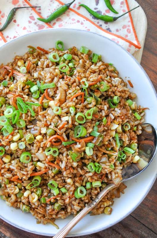 <p>Honey What's Cooking</p><p>Indo-Chinese vegetable fried brown rice makes a deliciously hearty meal.</p><p><strong>Get the recipe: <a href="https://www.honeywhatscooking.com/indo-chinese-fried-rice/" rel="nofollow noopener" target="_blank" data-ylk="slk:Indo-Chinese Vegetable Fried Brown Rice;elm:context_link;itc:0;sec:content-canvas" class="link ">Indo-Chinese Vegetable Fried Brown Rice</a></strong></p>