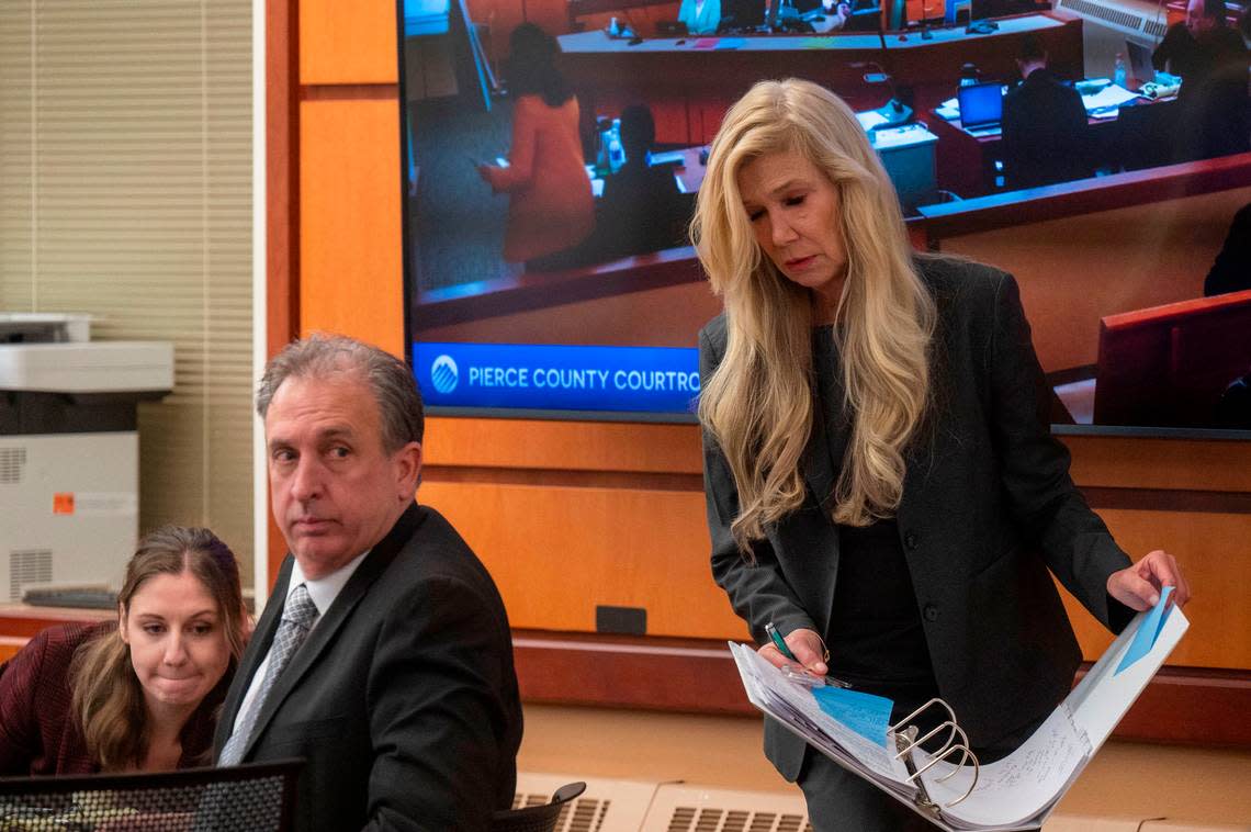 Pierce County Sheriff Ed Troyer looks over his shoulder as his attorney Anne Bremner returns to her seat after cross-examining Leah Heiberg, a South Sound 911 dispatcher, on Monday, Dec. 5, 2022, in Pierce County District Court in Tacoma.