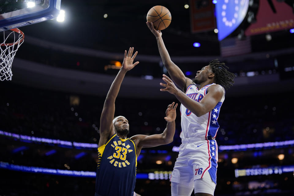 Philadelphia 76ers' Tyrese Maxey, right, goes up for a shot against Indiana Pacers' Myles Turner during the first half of an NBA basketball game, Sunday, Nov. 12, 2023, in Philadelphia. (AP Photo/Matt Slocum)