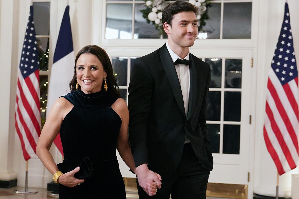 Actress Julia Louis-Dreyfus and her son Charlie Hall arrive for the White House state dinner for French President Emmanuel Macron at the White House on December 1, 2022 in Washington, DC. The official state visit is the first of the Biden administration.