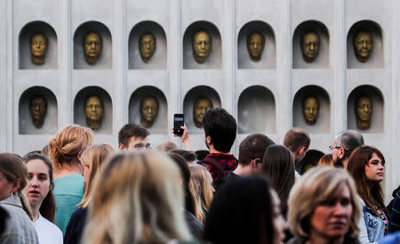 People gather before the screening of final episode of Game of Thrones on 20-meter-high screen at RZD Arena in Moscow, Russia May 20, 2019. REUTERS/Maxim Shemetov