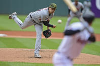 Detroit Tigers starting pitcher Alex Faedo, left, delivers to Cleveland Guardians' Myles Straw in the first inning of a baseball game, Sunday, May 22, 2022, in Cleveland. (AP Photo/David Dermer)