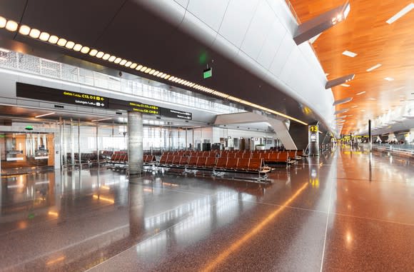 Modern airport seating area with warm architectural accents.