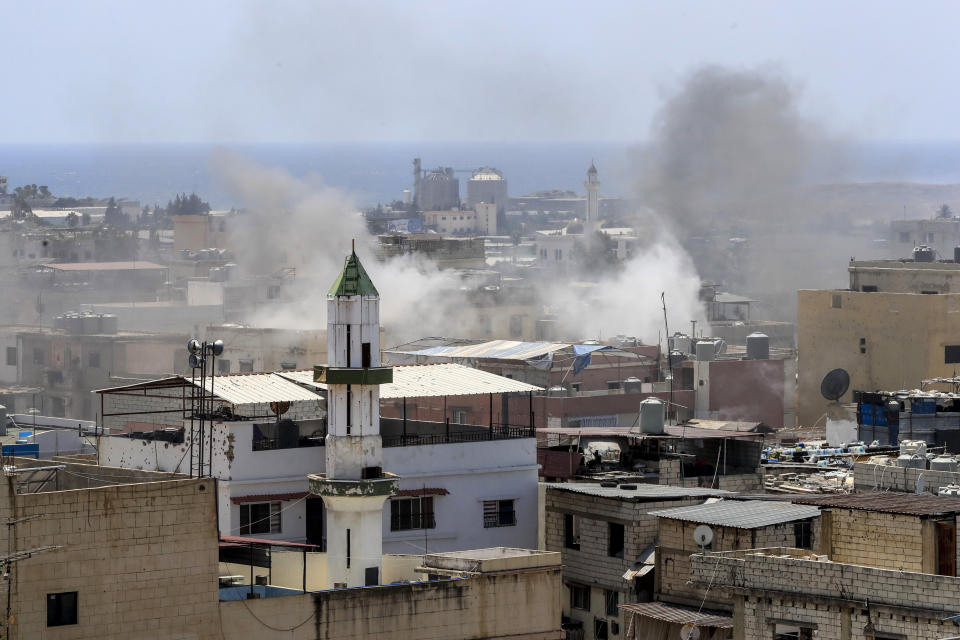 Smoke rises during a clashes that erupted between members of the Palestinian Fateh group and Islamist militants in the Palestinian refugee camp of Ein el-Hilweh near the southern port city of Sidon, Lebanon, Sunday, July 30, 2023. Palestinian officials say at least five people have been killed and several others wounded during clashes in Lebanon’s largest Palestinian refugee camp. (AP Photo/Mohammad Zaatari)