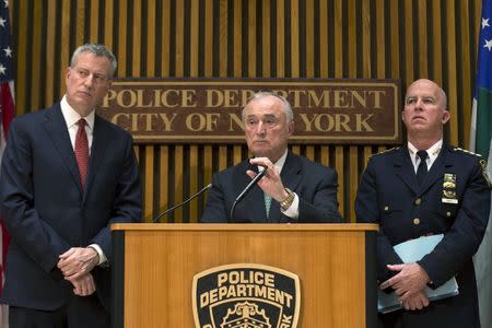 (L-R) New York City Mayor Bill de Blasio, Police Commissioner William Bratton and NYPD Chief of Department James P. O'Neill attend a news conference in New York, October 21, 2015. REUTERS/Brendan McDermid