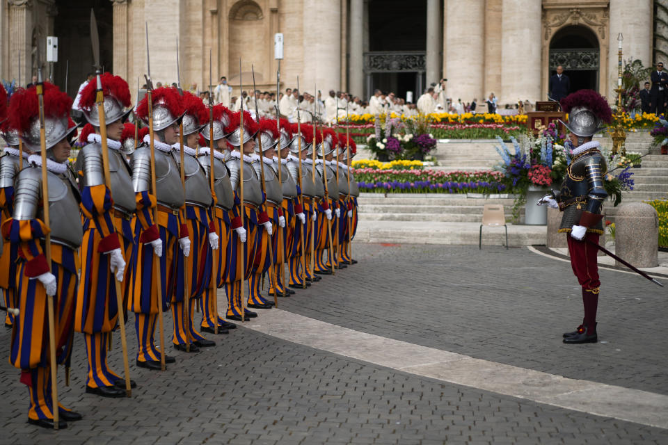 Vatican Swiss Guards take position in St. Peter's Square at The Vatican where Pope Francis will celebrate the Easter Sunday mass, Sunday, March 31, 2024. (AP Photo/Andrew Medichini)