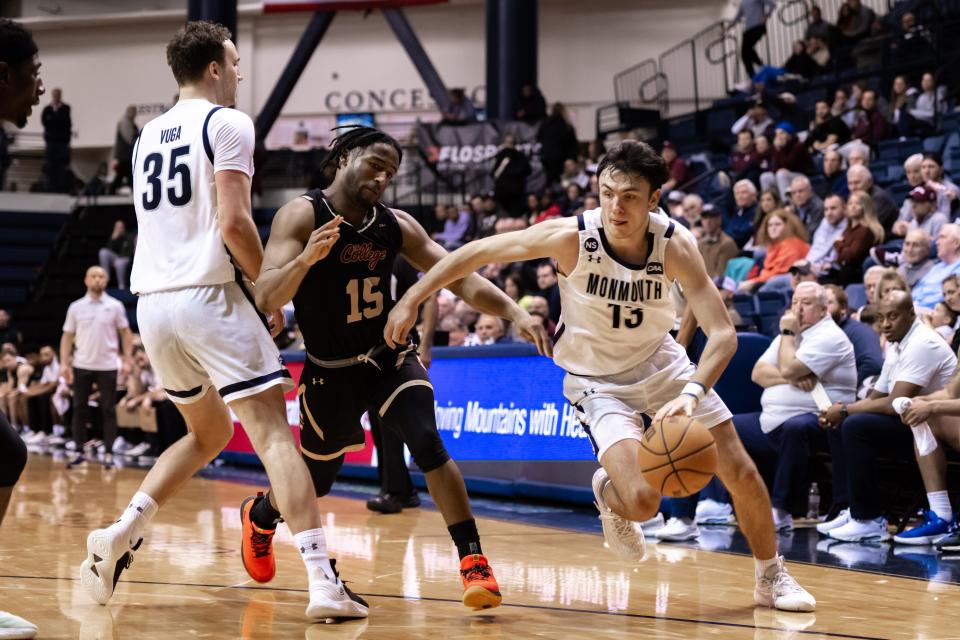Monmouth Hawks guard Jack Collins (13) drives to the basket against the Charleston Cougars during the second half at OceanFirst Bank Center. Mandatory Credit: John Jones-USA TODAY Sports
