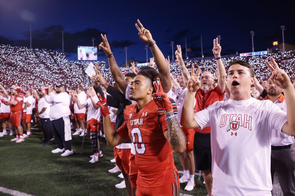 Utah Utes wide receiver Mikey Matthews (0) and other Utes honor Aaron Lowe and Ty Jordan during a timeout in Salt Lake City on Thursday, Aug. 31, 2023 during the season opener. Utah won 24-11. | Jeffrey D. Allred, Deseret News