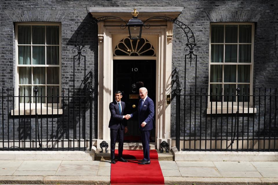 Prime Minister Rishi Sunak greets US President Joe Biden outside 10 Downing Street (PA)