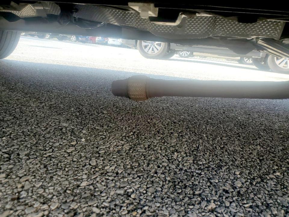 A photo of the underside of Macon Garway's car after he found his catalytic converter was stolen on Dec. 23, 2021.