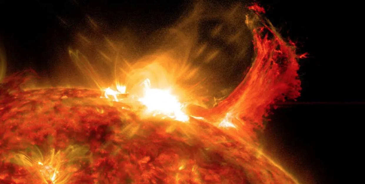  A solar flare erupts from the sun's surface. 