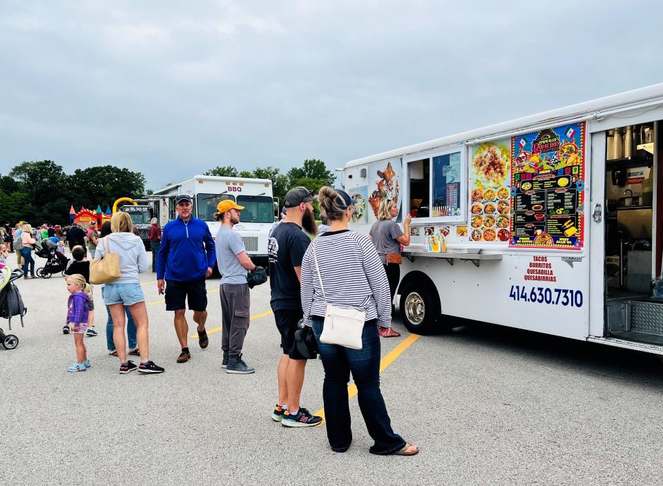 Customers gather around Romero’s Taco Truck at 10840 W. Rogers St., West Allis. Romero’s owners now have a dine-in location, Romero’s Restaurant and Bar in Greenfield.