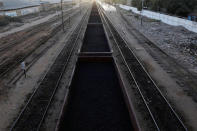 A cargo train loaded with coal dust, moves past the port area near City Station in Karachi, Pakistan September 24, 2018. REUTERS/Akhtar Soomro/Files