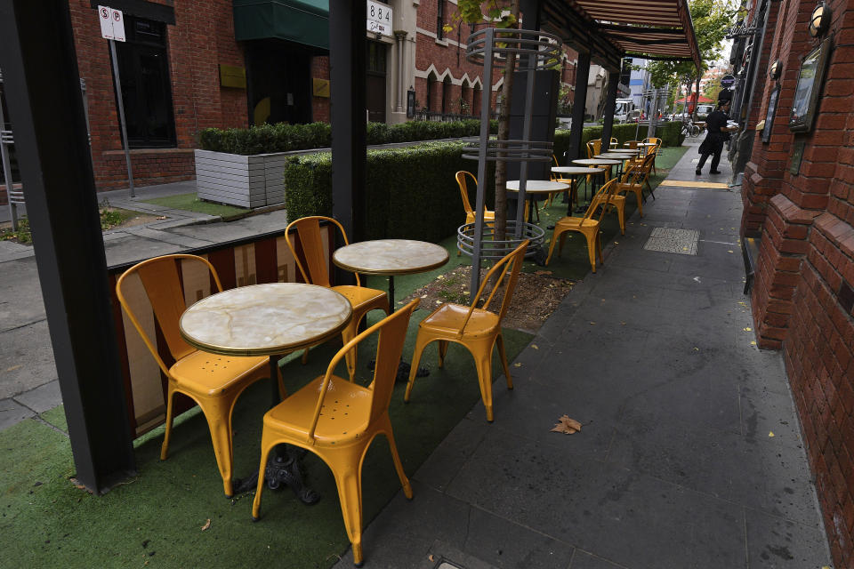 Seats are empty at a cafe in Melbourne, Australia, as the city enters a lockdown, Thursday, May 27, 2021. Australia’s second largest city announced a seven-day lockdown on Thursday as concern grows over dozens of cases of a COVID-19 variant found in India. (James Ross/AAP Image via AP)