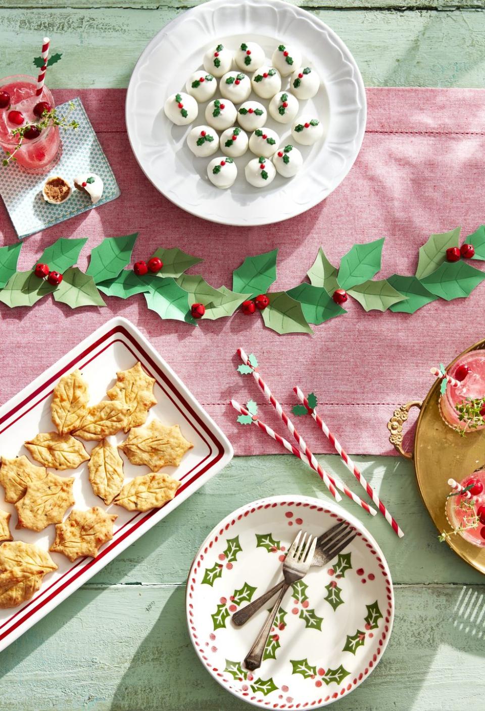 <p>Use spiny leaves and bold berries to create a holly-jolly Christmas table! </p><p><strong>To male: </strong>Cut holly leaves from dark and light green card stock. Use a bone folder or wooden skewer to indent veins in leave, then trace indents with a green colored pencil. Run down the center of the table and lay red jingle bells throughout. For the straws, attach small die-cut holly leaves and berries to a red-and-white paper straw with a dab of hot glue. </p><p><a class="link " href="https://www.amazon.com/CLLOOTVE-Holiday-Christmas-Festival-Decoration/dp/B0716NV7V5/ref=sr_1_5?tag=syn-yahoo-20&ascsubtag=%5Bartid%7C10050.g.644%5Bsrc%7Cyahoo-us" rel="nofollow noopener" target="_blank" data-ylk="slk:Shop Now;elm:context_link;itc:0;sec:content-canvas">Shop Now</a></p>