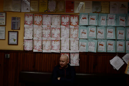 Miner Krzysztof Zawisza, 32, waits for his daughter Julia, 6, at a kindergarten near Nikiszowiec district in Katowice, Poland, November 8, 2018. REUTERS/Kacper Pempel