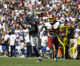 Dallas Cowboys wide receiver Devin Smith reaches out to make a catch and score against Washington Redskins cornerback Josh Norman (24) in the first half of an NFL football game, Sunday, Sept. 15, 2019, in Landover, Md. (AP Photo/Evan Vucci)