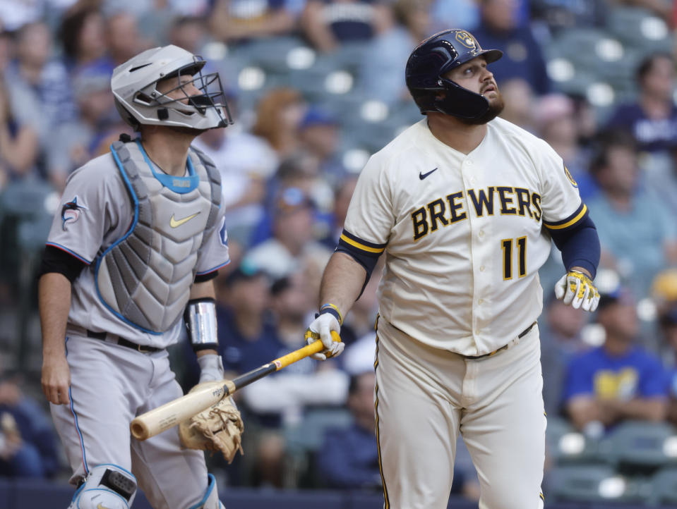 Milwaukee Brewers' Rowdy Tellez hits a sacrifice fly to score a run against the Miami Marlins during the fourth inning of a baseball game Thursday, Sept. 14, 2023, in Milwaukee. (AP Photo/Jeffrey Phelps)
