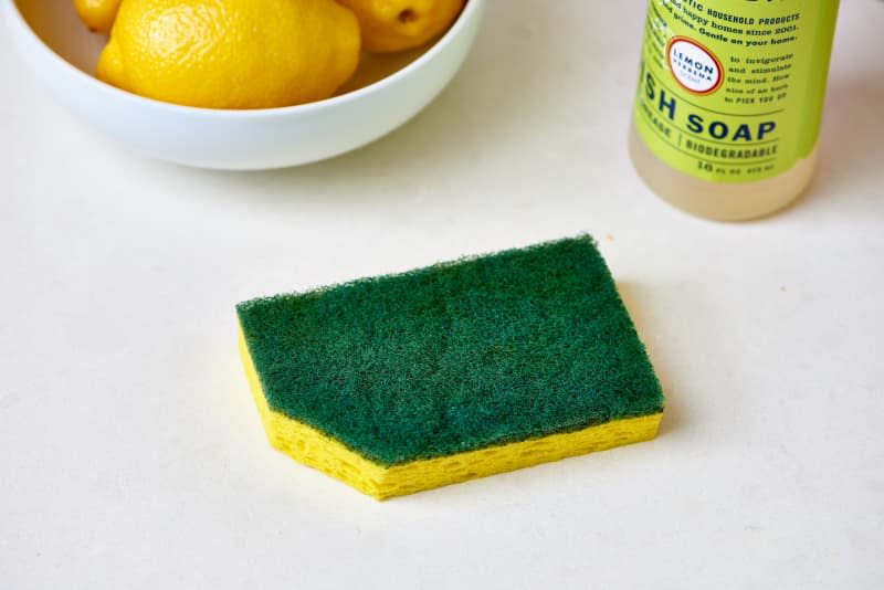 A sponge with a corner cut off.