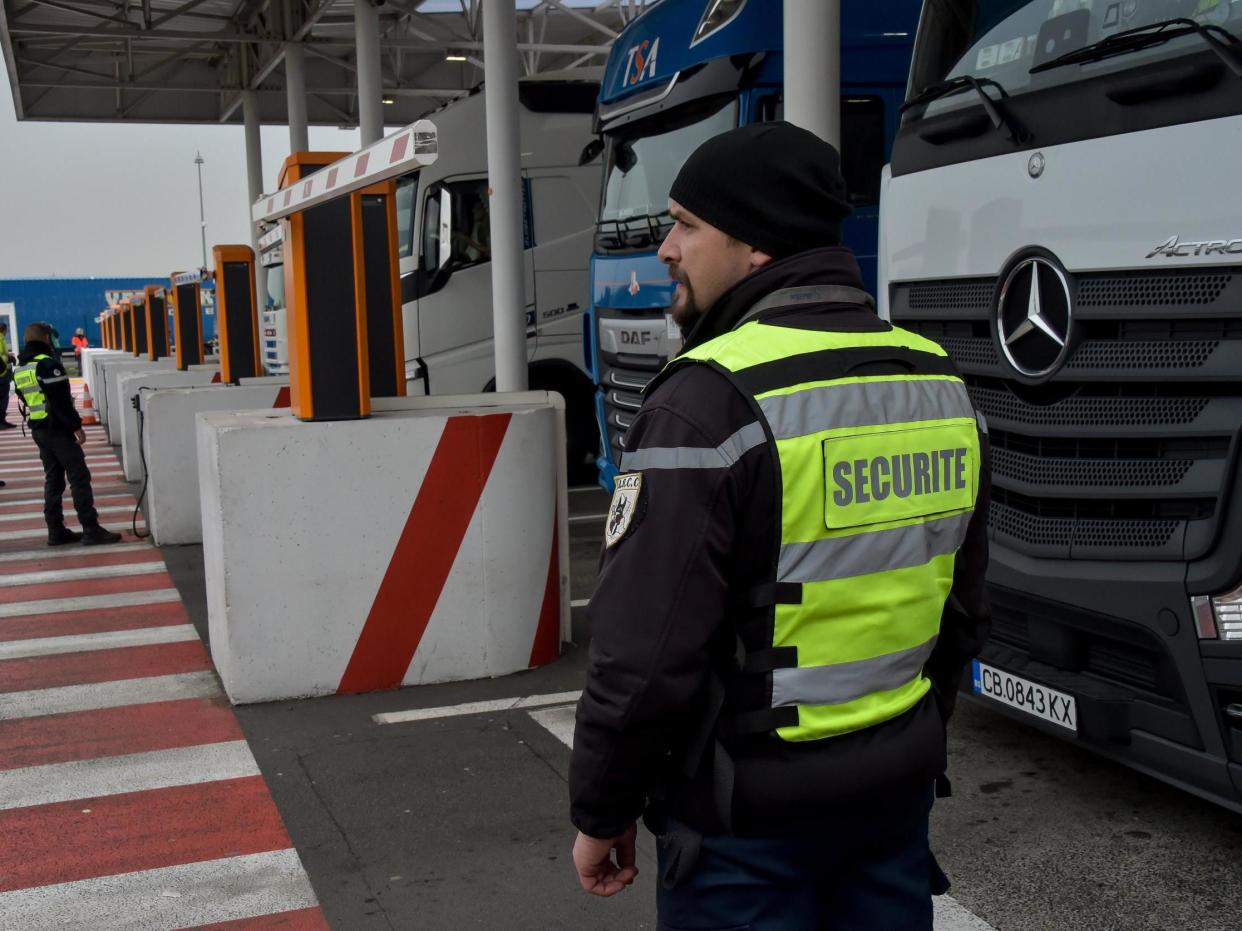 A security agent controls lorries at the Coquelles Eurotunnel border post in 2019: Philippe Huguen/AFP via Getty Images